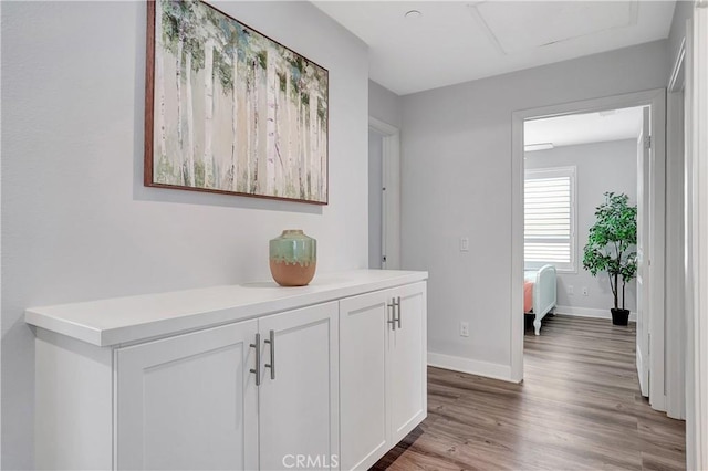 corridor featuring hardwood / wood-style floors