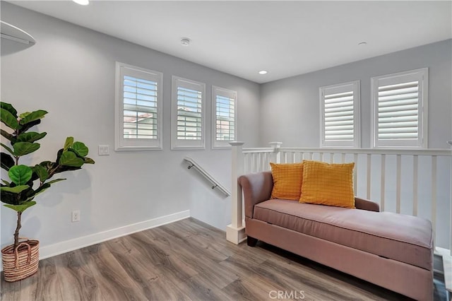 living area with hardwood / wood-style flooring