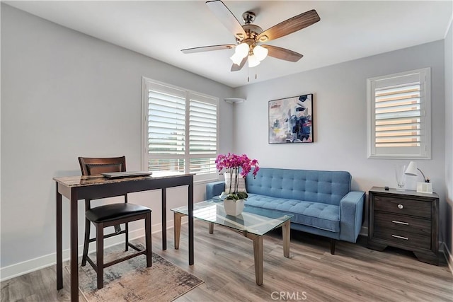 office with ceiling fan and light wood-type flooring