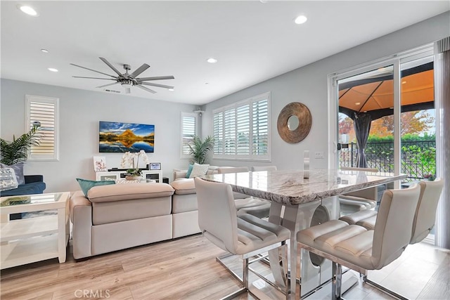 dining room featuring ceiling fan and light wood-type flooring