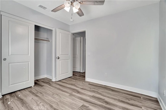 unfurnished bedroom with a closet, ceiling fan, and light hardwood / wood-style flooring