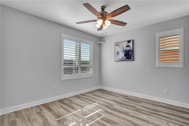 empty room featuring light hardwood / wood-style floors and ceiling fan