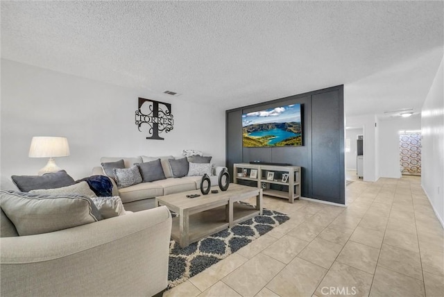 tiled living room with a textured ceiling