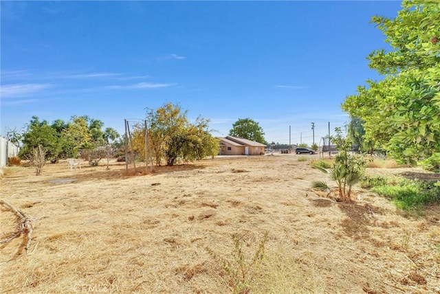 view of yard with a rural view