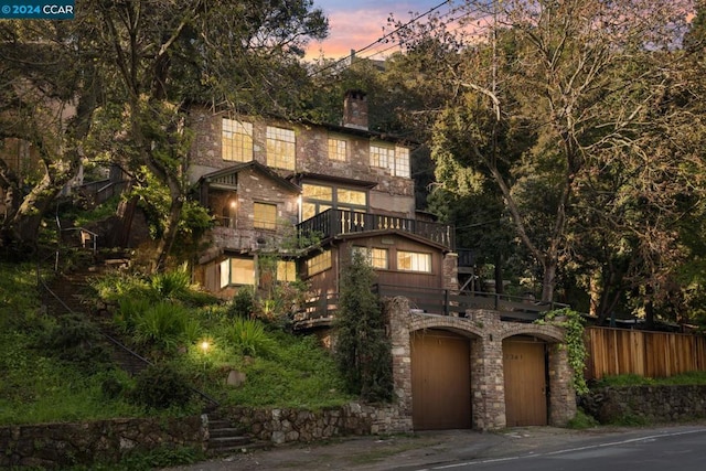 view of front of house featuring a balcony