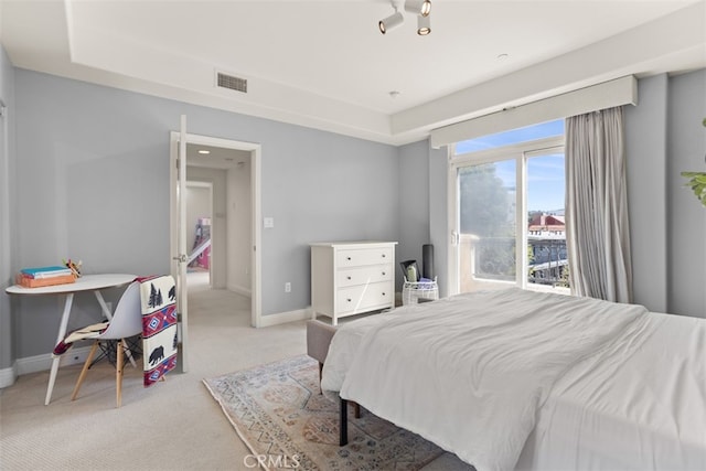 bedroom featuring light colored carpet