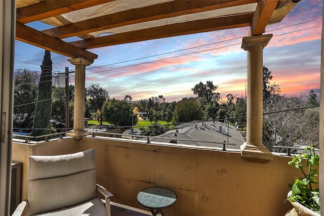 view of balcony at dusk