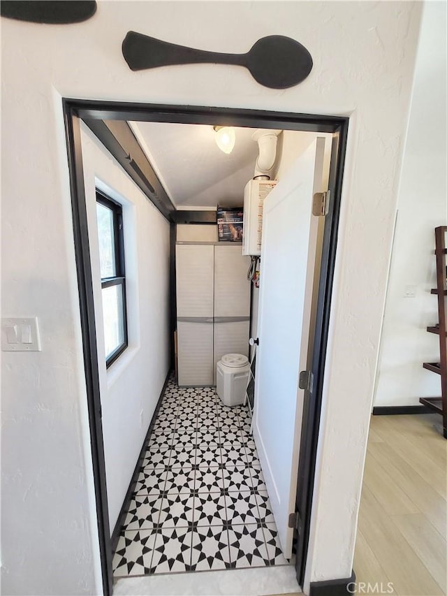 bathroom featuring lofted ceiling