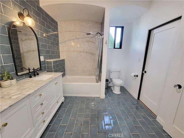 full bathroom with vanity, toilet, and shower / bath combo with shower curtain