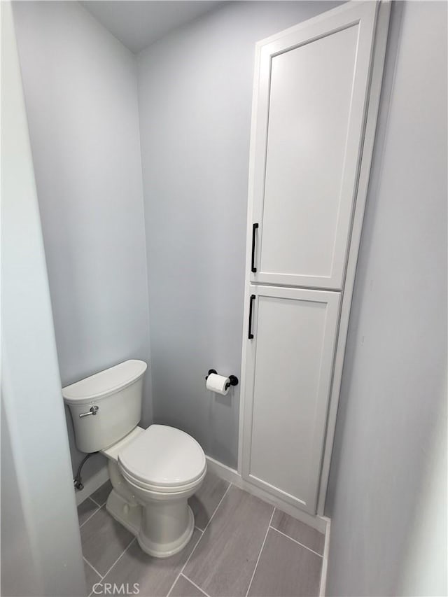 bathroom featuring tile patterned floors and toilet