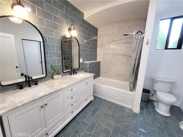 full bathroom featuring vanity, toilet, and shower / bathtub combination with curtain