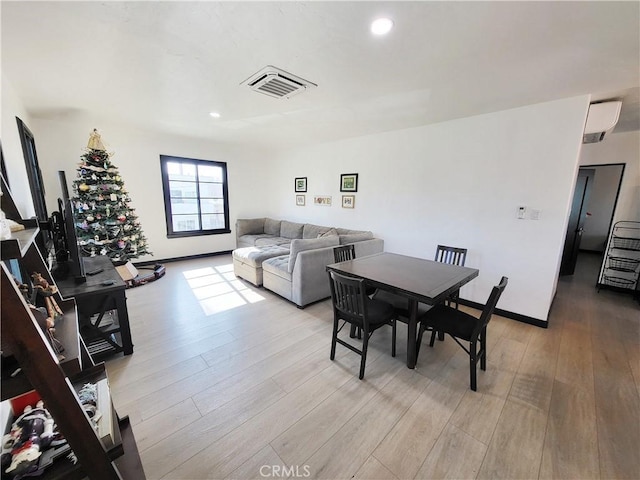 dining room with light hardwood / wood-style floors