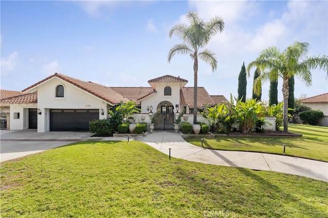 mediterranean / spanish-style house with a garage and a front yard