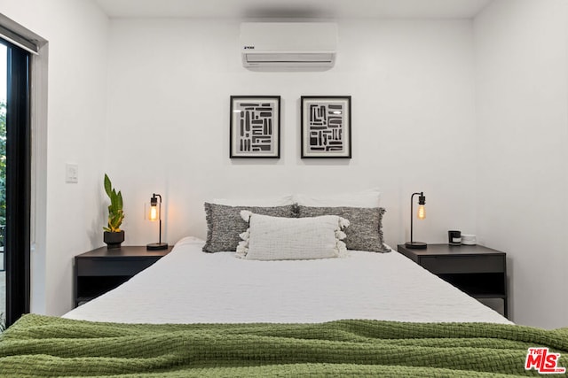 bedroom featuring a wall mounted AC