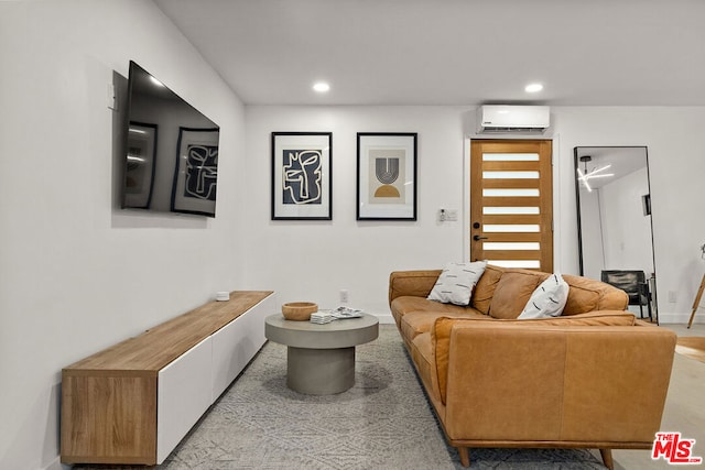 living room with a wall unit AC and light carpet