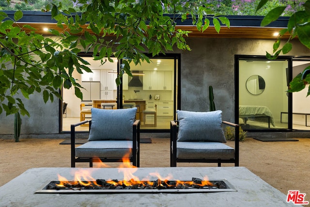 view of patio / terrace featuring an outdoor fire pit