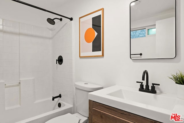 full bathroom with vanity, toilet, and tiled shower / bath combo