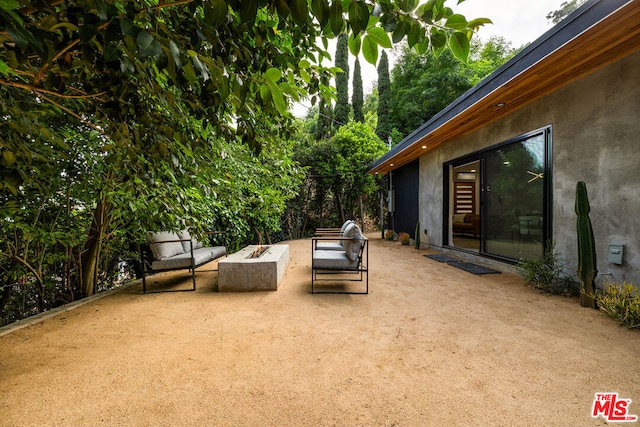 view of patio / terrace with an outdoor fire pit