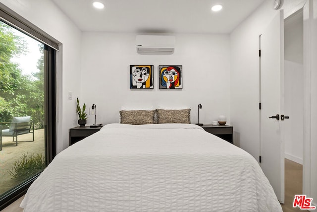 bedroom featuring a wall mounted AC