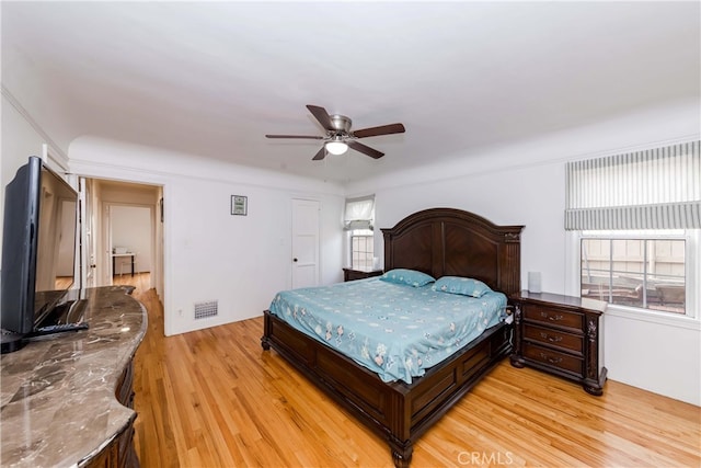 bedroom featuring ceiling fan and light hardwood / wood-style floors