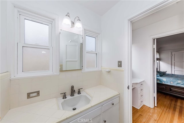 bathroom with hardwood / wood-style floors and vanity