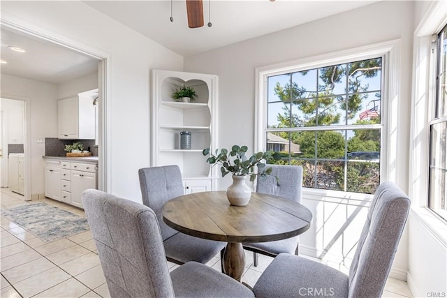 dining room featuring light tile patterned floors and ceiling fan