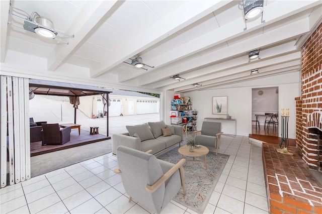 tiled living room with ceiling fan and lofted ceiling with beams