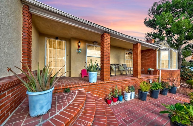 exterior space featuring covered porch