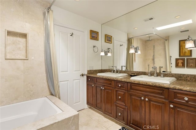 bathroom with tile patterned flooring, vanity, and independent shower and bath