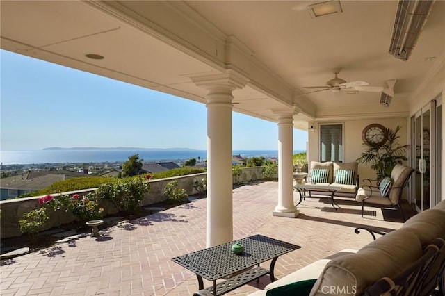 view of patio featuring ceiling fan and an outdoor living space