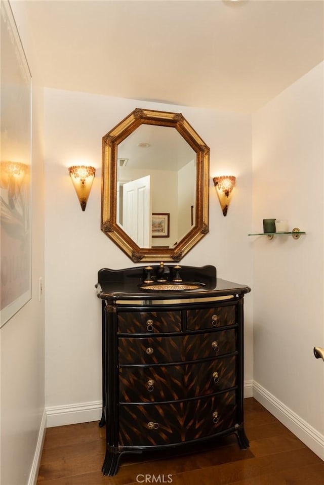 bathroom featuring vanity and wood-type flooring