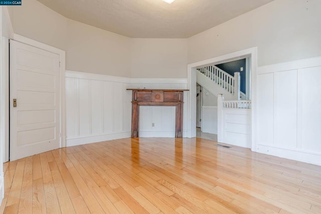 unfurnished living room featuring light wood-type flooring