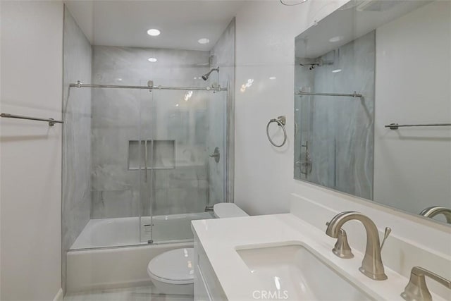 full bathroom with toilet, vanity, and combined bath / shower with glass door