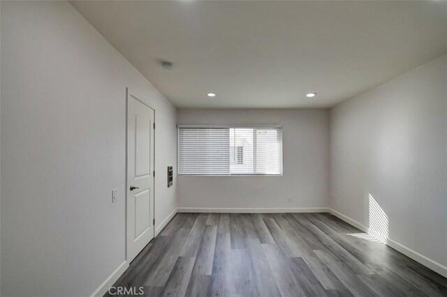 empty room featuring wood-type flooring