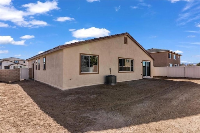 rear view of house with cooling unit