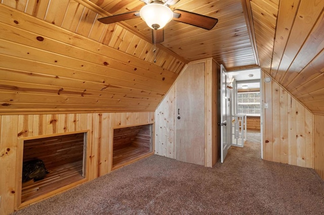 bonus room with carpet, wood walls, wood ceiling, and vaulted ceiling