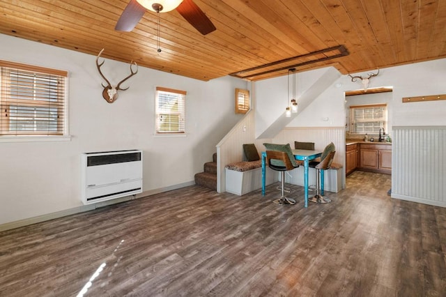 office space with wood ceiling, dark wood-type flooring, and heating unit