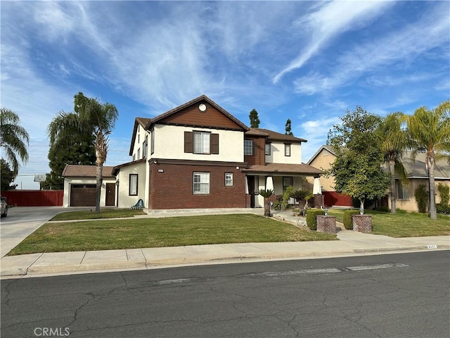 view of front of house with a front yard and a garage