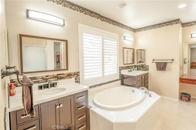 bathroom featuring separate shower and tub, tile patterned flooring, and vanity