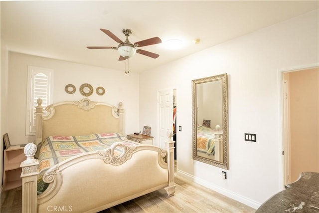 bedroom featuring light hardwood / wood-style floors and ceiling fan