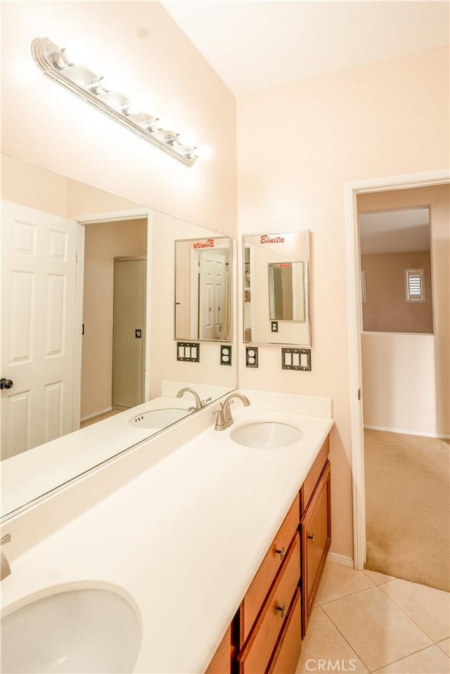 bathroom with tile patterned floors and vanity