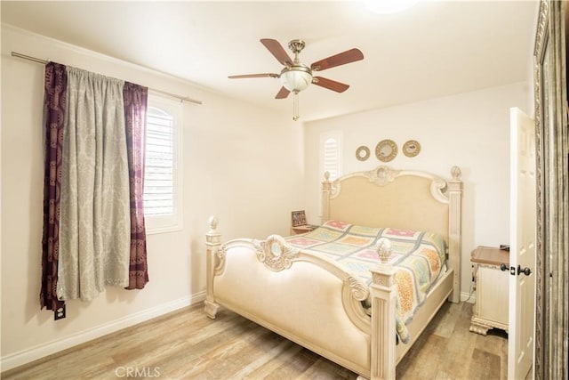 bedroom featuring ceiling fan and light hardwood / wood-style floors