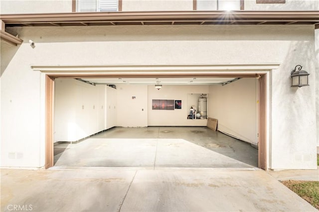 garage featuring secured water heater