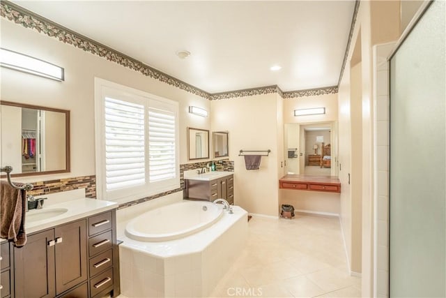 bathroom featuring separate shower and tub, tile patterned flooring, and vanity