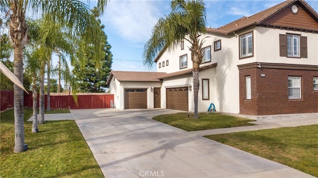 view of front of house with a front yard and a garage