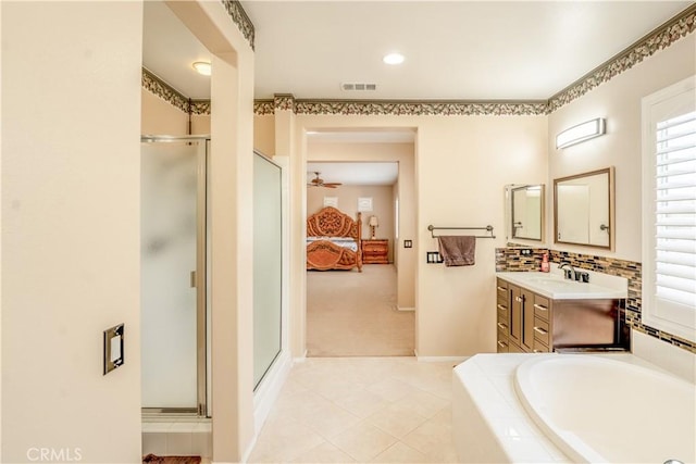 bathroom with vanity, ceiling fan, and independent shower and bath