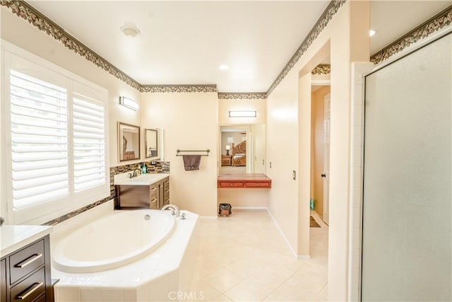 bathroom with vanity and separate shower and tub