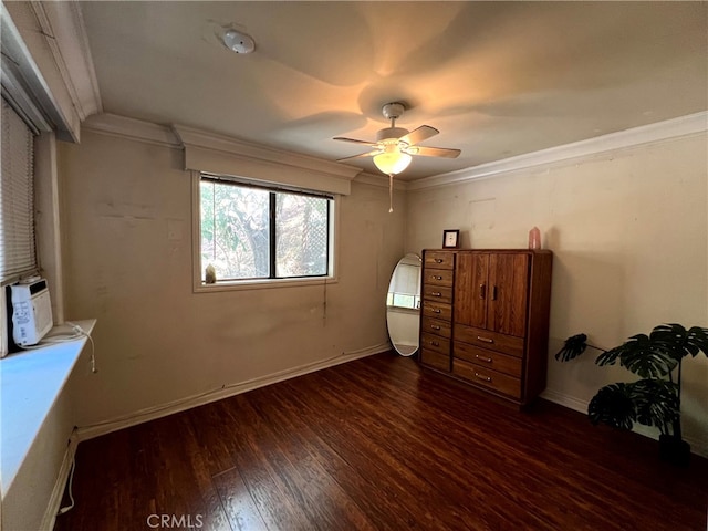 unfurnished bedroom with crown molding, dark wood-type flooring, and ceiling fan