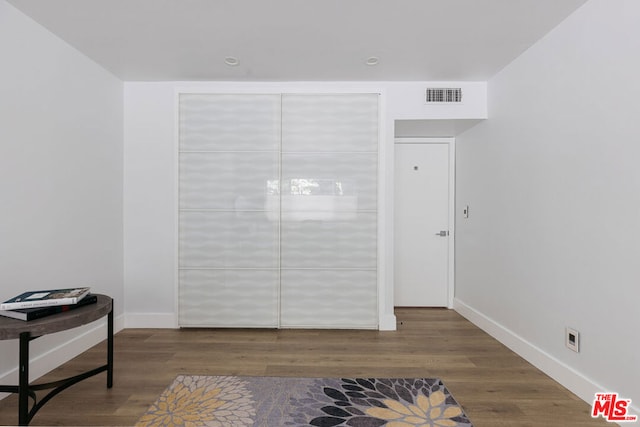 living area featuring dark wood-type flooring