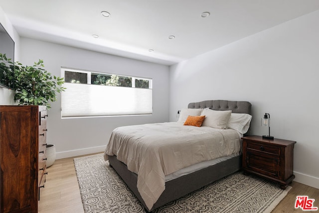 bedroom featuring light hardwood / wood-style floors